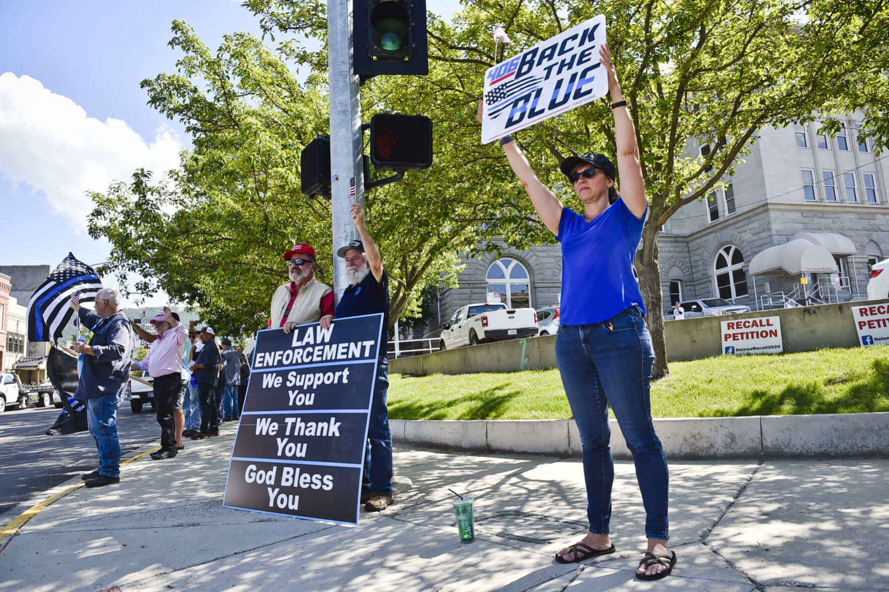 Charlotte Snyder, right, holds a "Back the Blue"